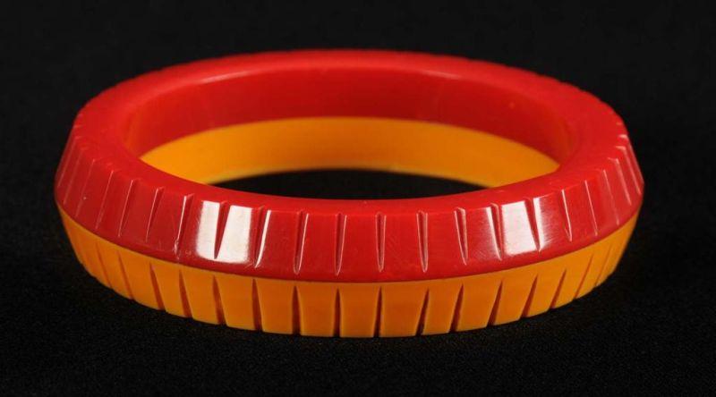 Appraisal: Bakelite Cream Red Bracelet Carved to Point Description Laminated Condition