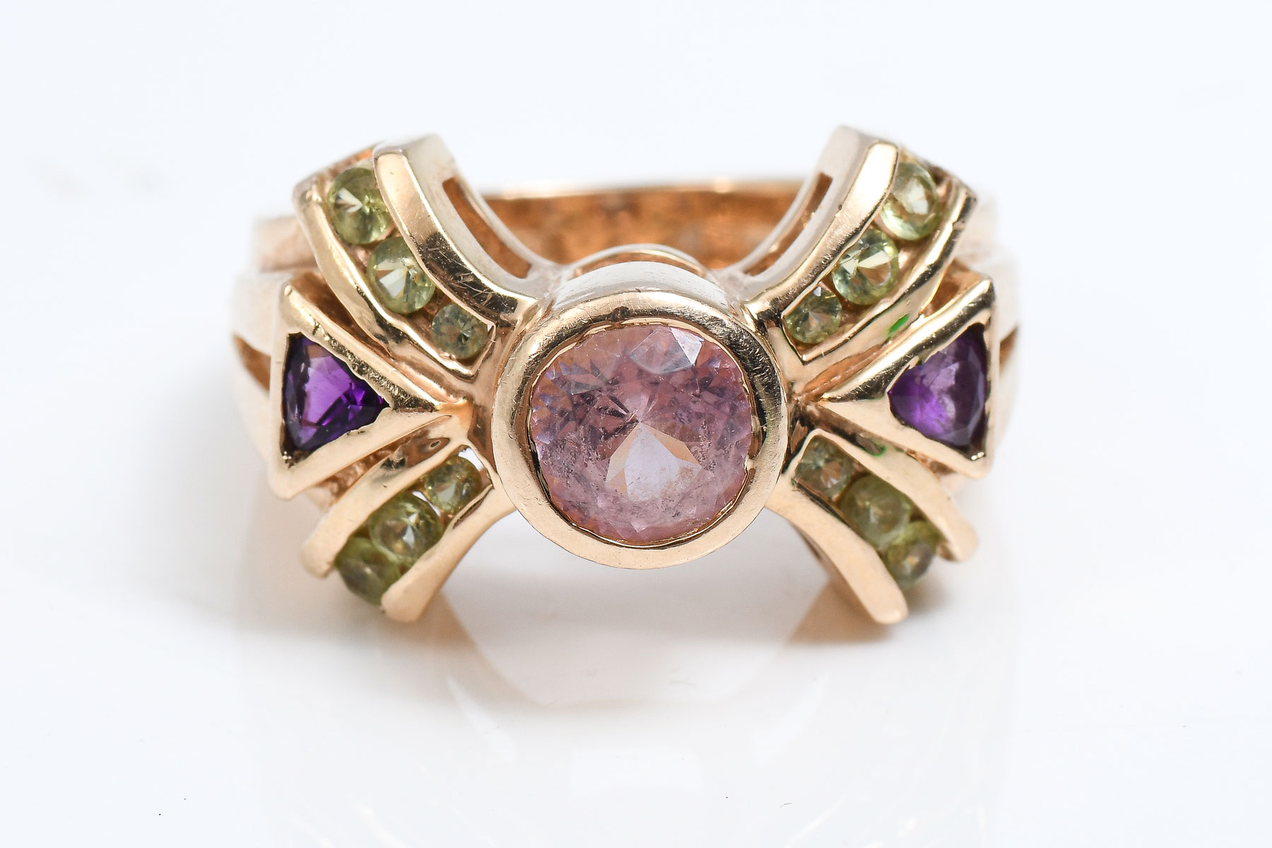 Appraisal: K PURPLE-GREEN-PINK TOURMALINE RING Pink tourmaline is featured in this