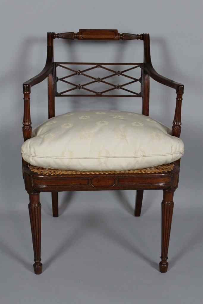 Appraisal: GEORGE III MAHOGANY CANED SEAT ARMCHAIR th century the panel