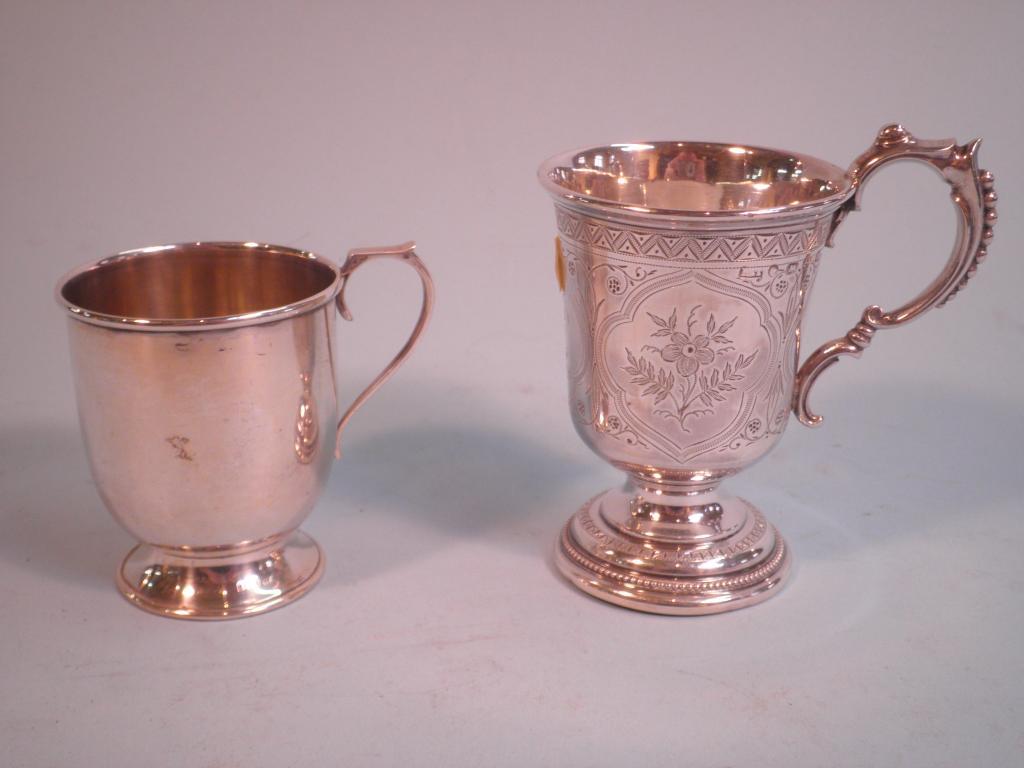 Appraisal: A Victorian silver christening mug the scroll handle cast with