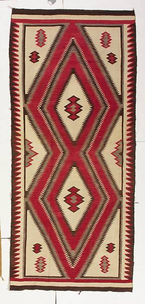 Appraisal: A Navajo rug Centering two finely serrated diamond lozenges stacked