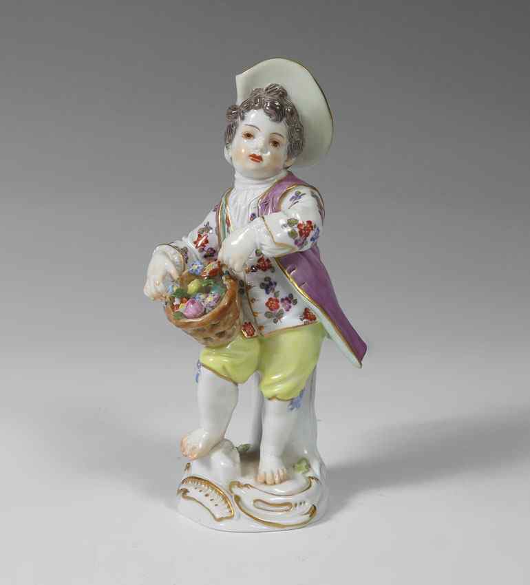 Appraisal: MEISSEN GERMAN PORCELAIN FIGURE Young boy with flower gathering basket