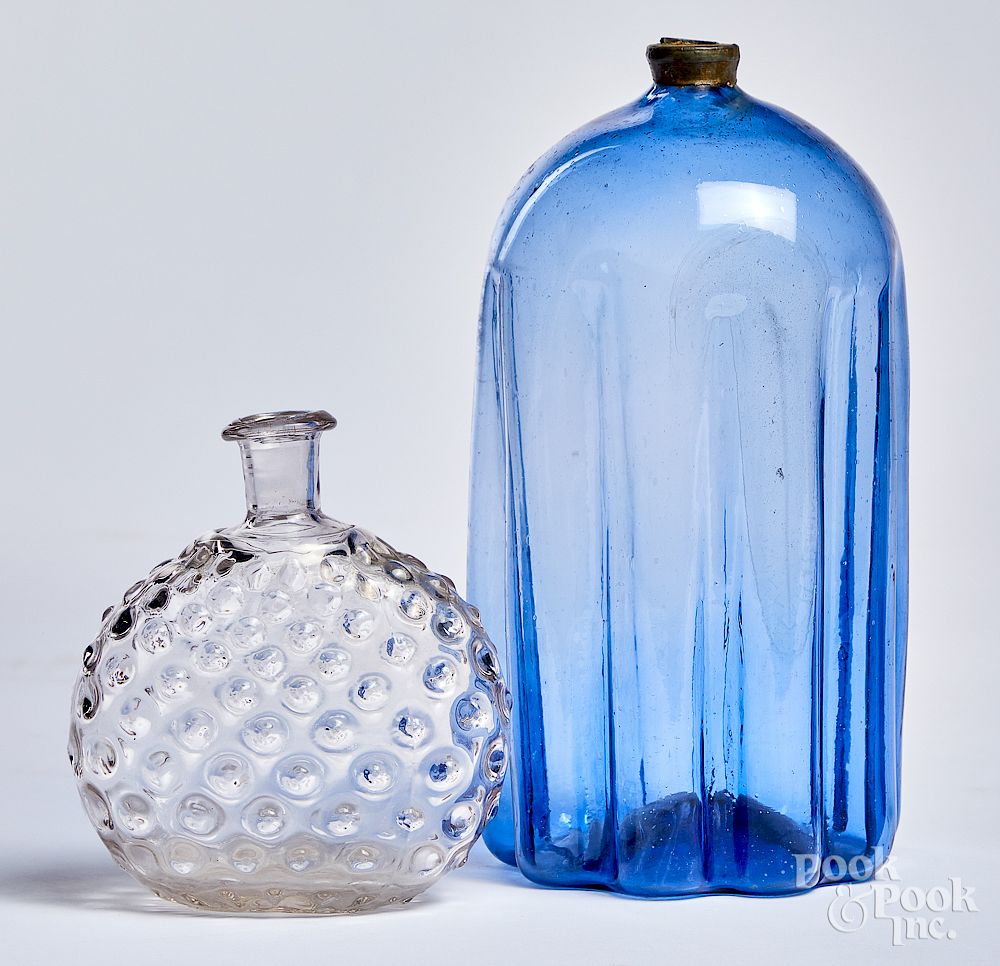 Appraisal: Pale purple blue glass bottle and colorless flask Pale purple