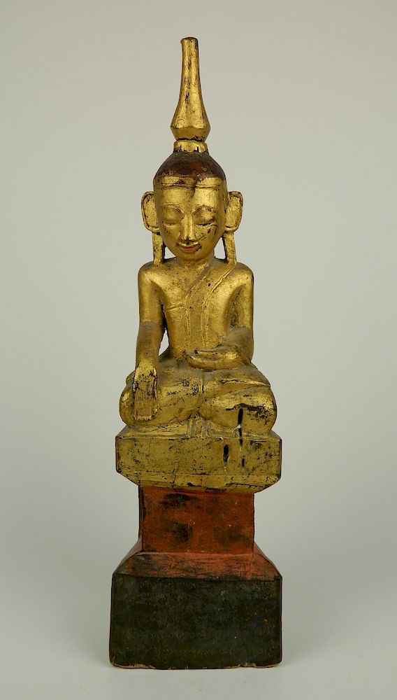 Appraisal: Carved and gilded wood Buddha th thc Carved and gilded