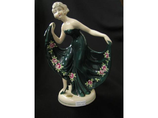 Appraisal: Art Deco Pottery Figurine of a Lady in elaborate green