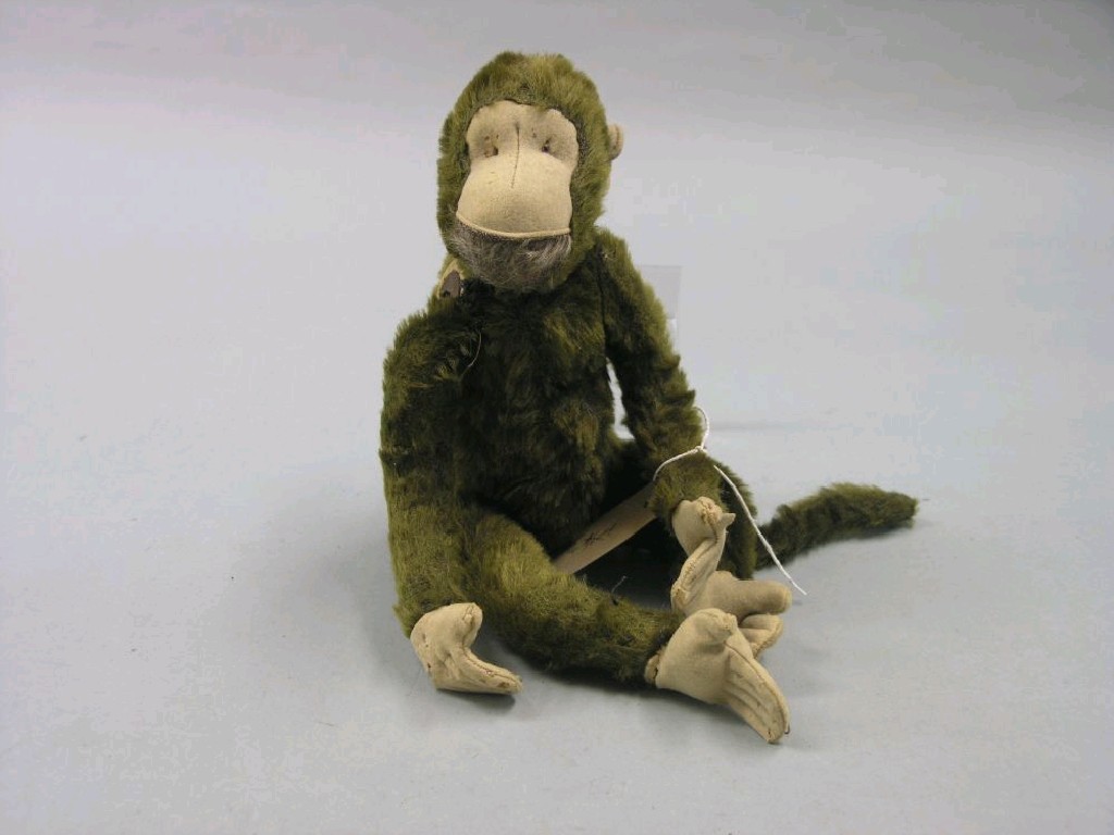 Appraisal: A toy monkey pre-war brown plush with jointed limbs in