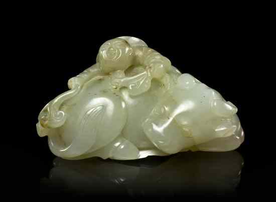 Appraisal: A White Jade Model of a Buffalo having russet inclusions