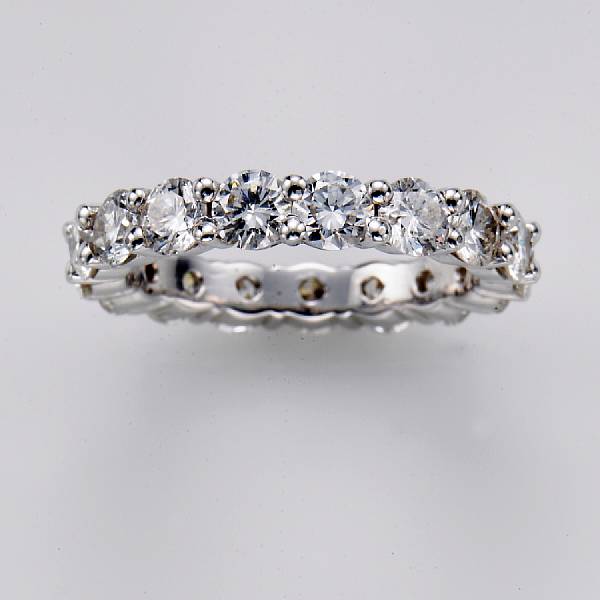 Appraisal: A diamond and fourteen karat white gold eternity band estimated