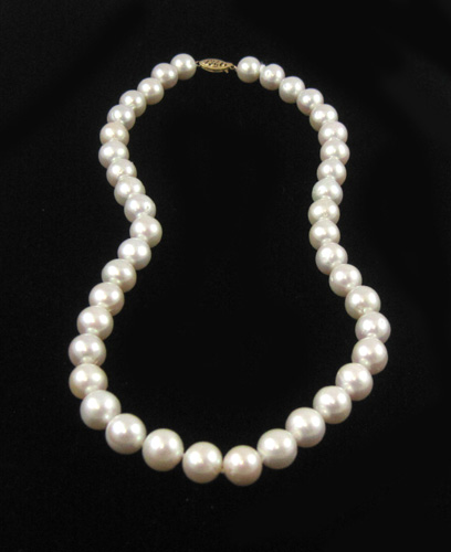 Appraisal: PRINCESS LENGTH WHITE PEARL NECKLACE strung with off-round white pearls