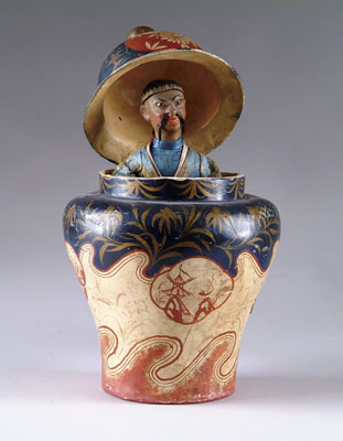 Appraisal: ORIENTAL GENTLEMAN IN EWER AUTOMATON A marvelous automaton of a