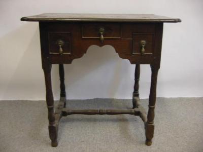 Appraisal: AN OAK LOWBOY early th century and later the crossbanded