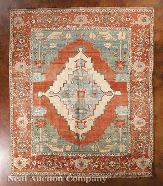 Appraisal: A Persian Serapi Carpet serrated central medallion and spandrels red