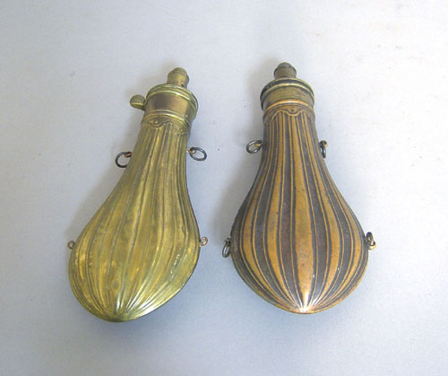 Appraisal: Two fluted copper powder flasks late th c one marked