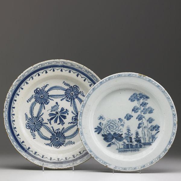 Appraisal: DELFT Two chargers one with floral decoration the other with