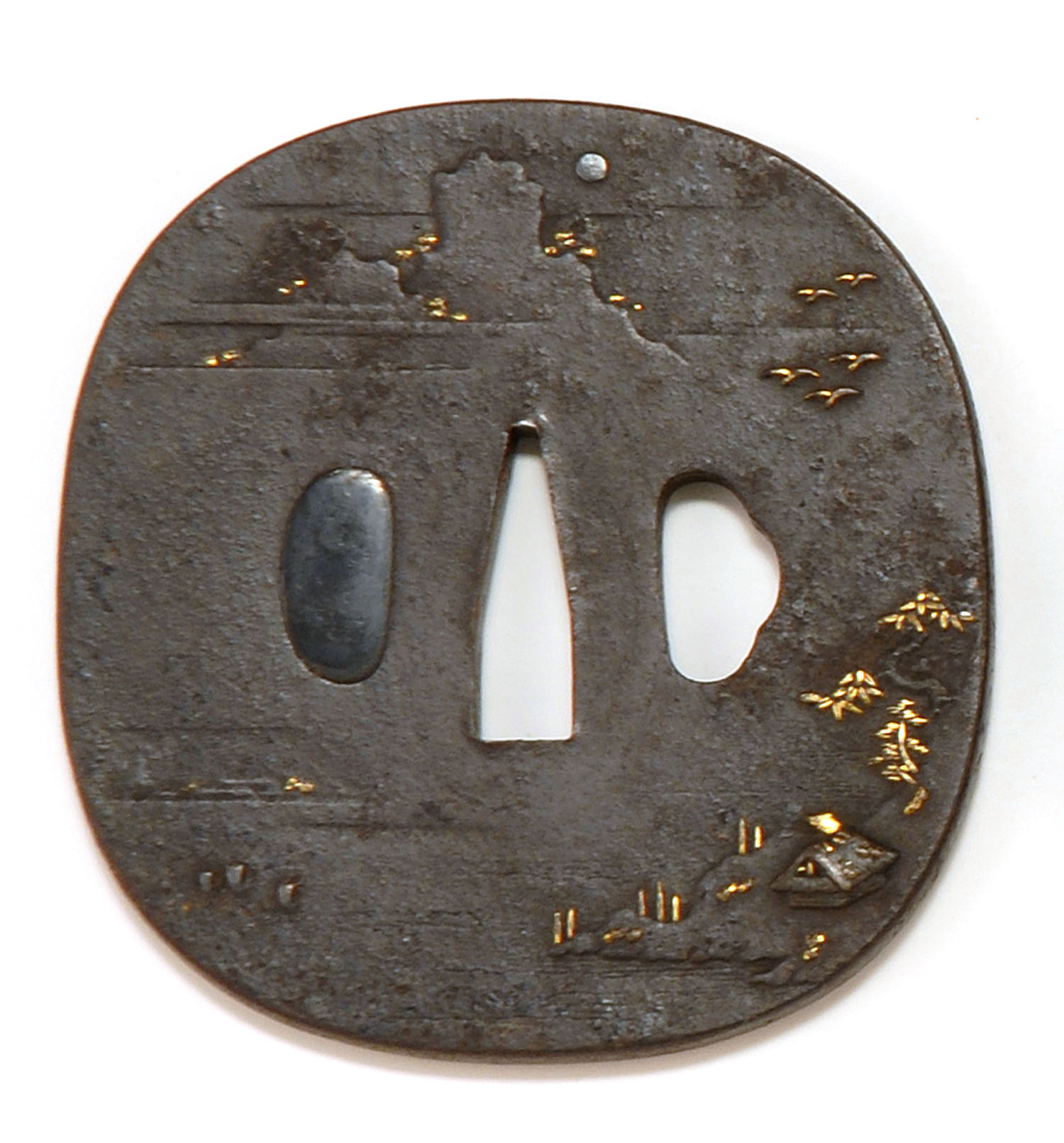 Appraisal: INLAID IRON NAGA MARU-GATA TSUBA Early th CenturyWith gold and