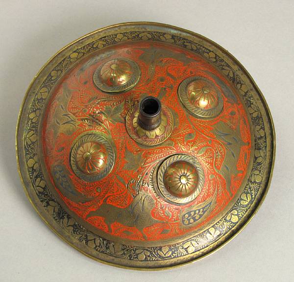 Appraisal: An Indian combination shield percussion pistol The circular brass buckler