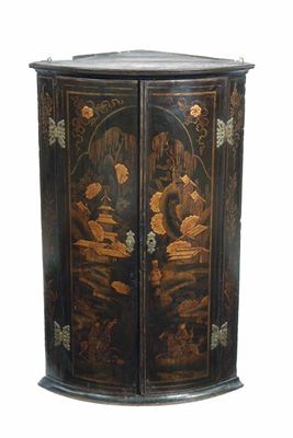 Appraisal: An th century japanned bowfront hanging corner cupboard decorated with