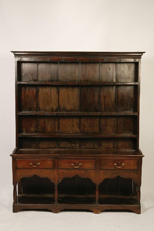 Appraisal: A GEORGE III OAK DRESSER the raised back with a