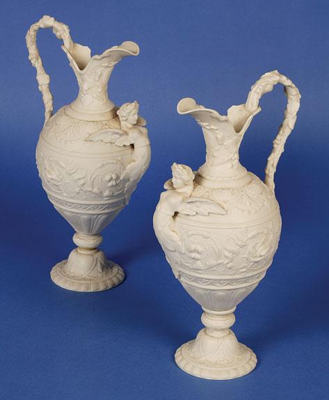 Appraisal: A PAIR OF LATE VICTORIAN COPELAND PARIAN WARE EWERS of