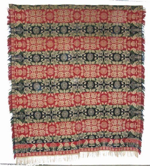 Appraisal: Coverlet piece with cream ground and blue green and red