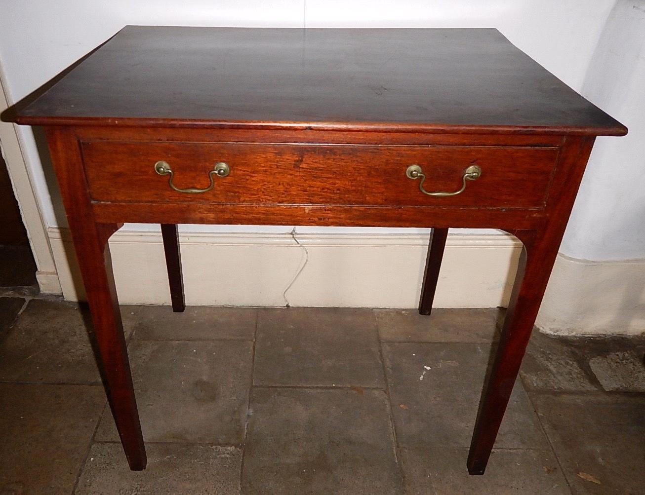 Appraisal: A George III mahogany hall table fitted with a single