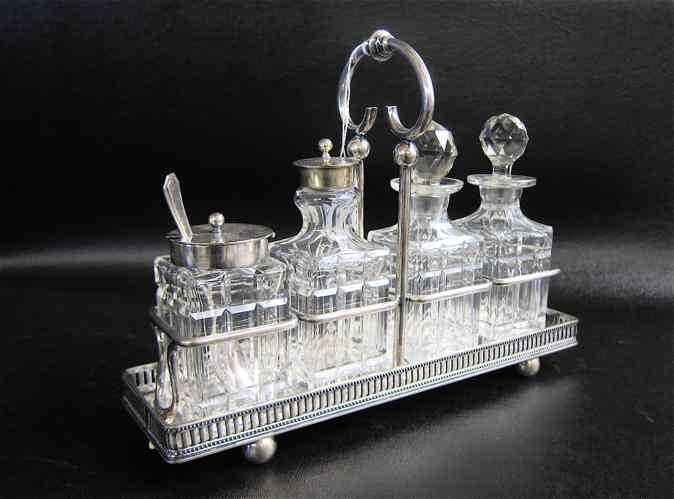 Appraisal: AMERICAN SILVER PLATED AND GLASS CASTOR SET by J B