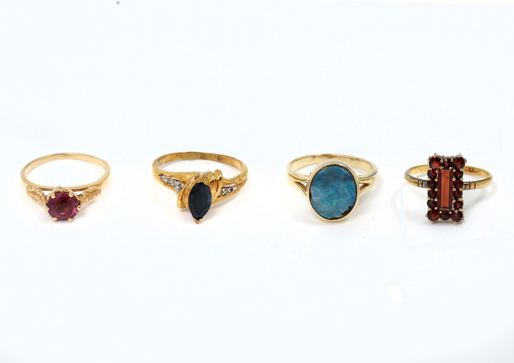 Appraisal: LOT OF GEMSTONE RINGS Three K and one sterling vermeil