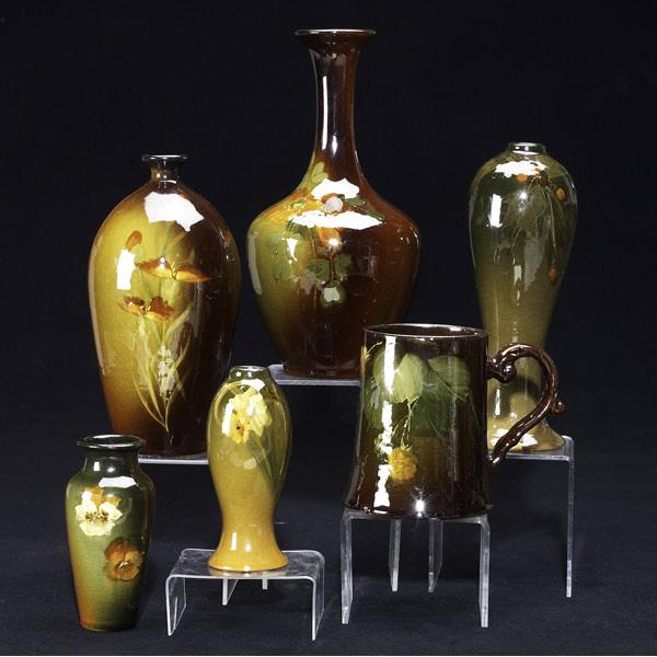 Appraisal: ROSEVILLE Rozane six vessels painted with blossoms Chips to bud