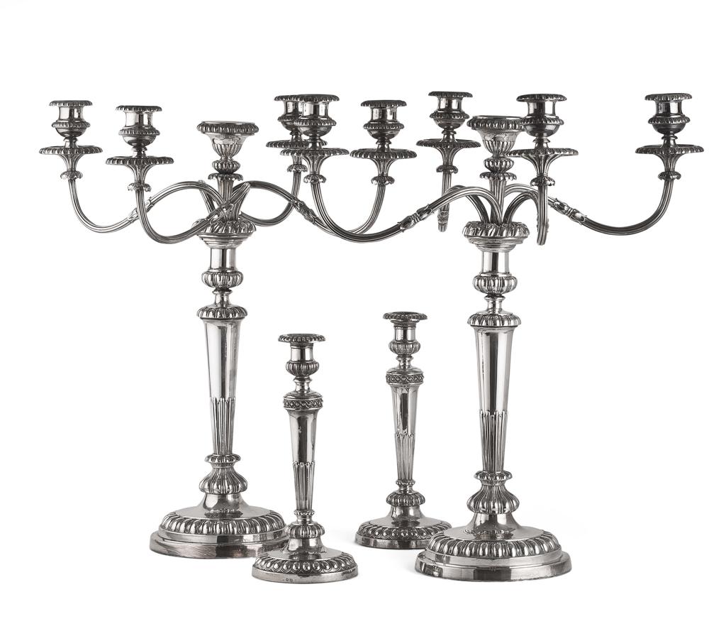 Appraisal: PAIR OF GEORGIAN STYLE SILVERPLATED CANDELABRA each with a central