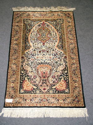 Appraisal: A Hereke prayer rug with tree of life and stylized