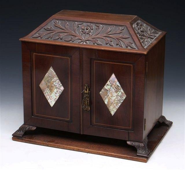 Appraisal: A LATE VICTORIAN MAHOGANY TABLE CABINET the top carved with