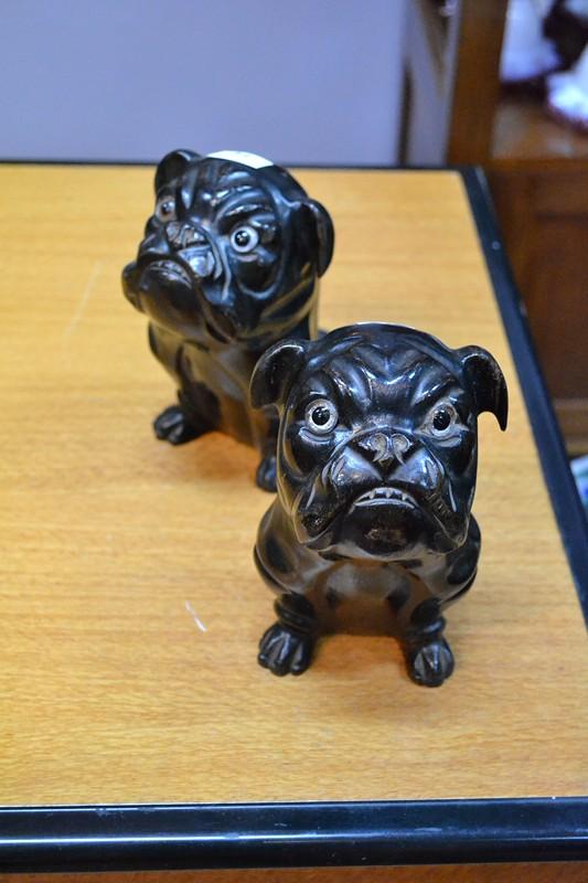 Appraisal: A PAIR OF EBONISED WOOD BOOKENDS OF PUG DOGS LOSS