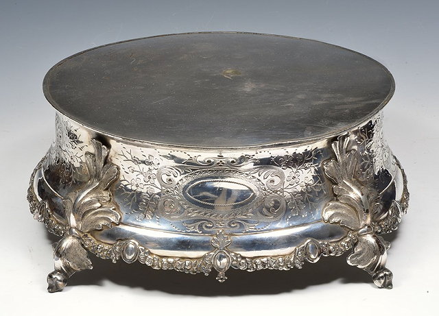 Appraisal: A LARGE SILVER PLATED CAKE STAND with engraved and applied