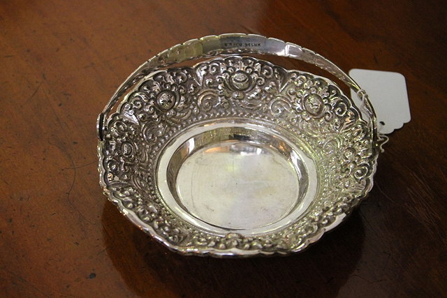 Appraisal: A CONTINENTAL WHITE METAL DISH of circular form with embossed