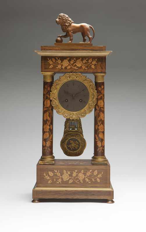 Appraisal: A French marquetry portico mantle clock Second half th century