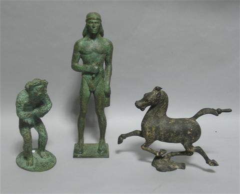 Appraisal: THREE ARCHAISTIC BRONZE SCULPTURES The first in the Greek style