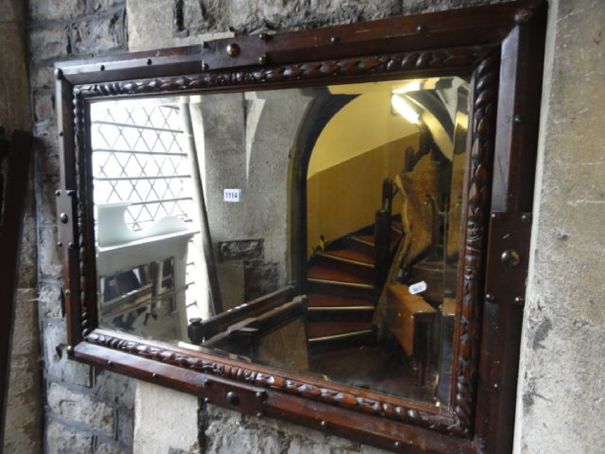 Appraisal: A stained pine framed wall mirror of rectangular form with