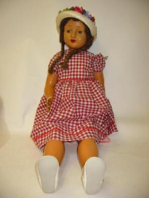 Appraisal: An English composition girl doll with brown glass sleeping eyes