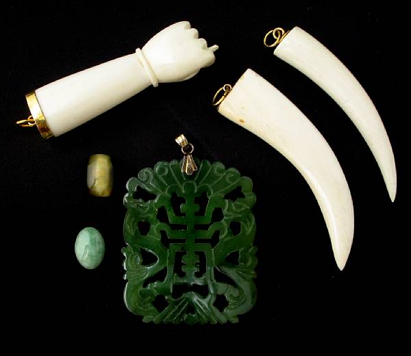 Appraisal: A collection of ivory hard stone and gold jewelry including