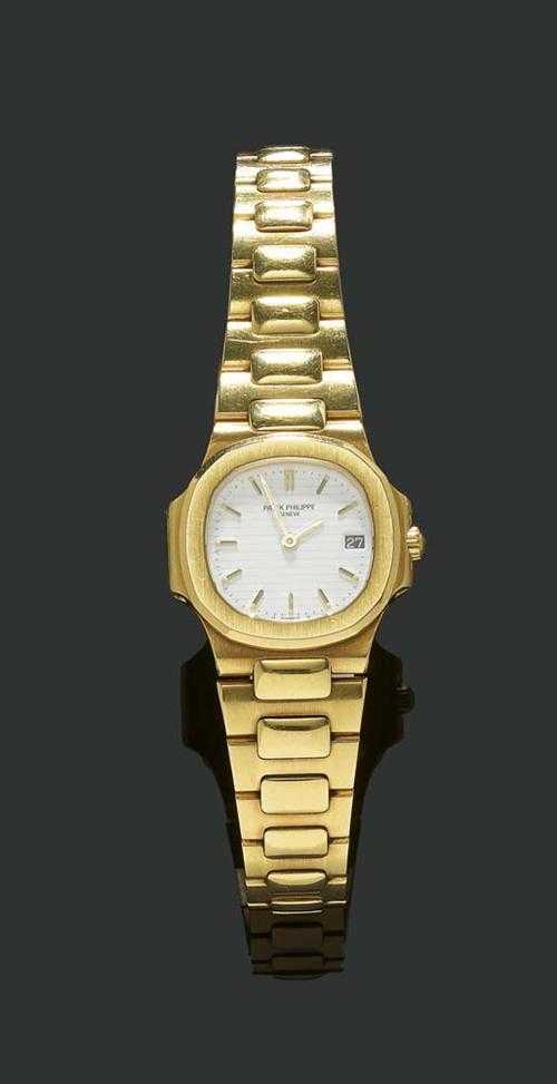 Appraisal: LADY'S WRISTWATCH PATEK PHILIPPE NAUTILUS s Yellow gold Rounded case