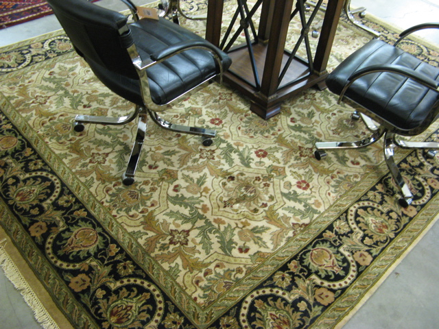 Appraisal: HAND KNOTTED ORIENTAL CARPET Indo-Persian overall floral decoration on cream