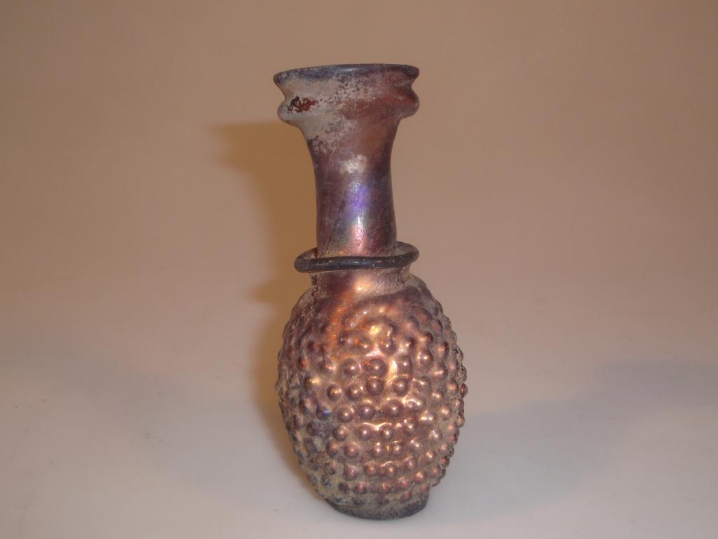 Appraisal: A pale streaky purple mould-blown glass grape-flask the flaring mouth