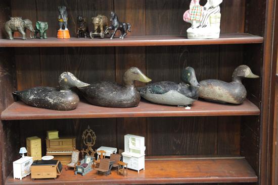 Appraisal: GROUP OF FOUR CARVED AND PAINTED WOODEN DUCK DECOYS Including