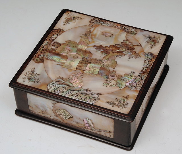 Appraisal: A CHINESE RECTANGULAR BOX with mother-of-pearl cover showing pavilions and