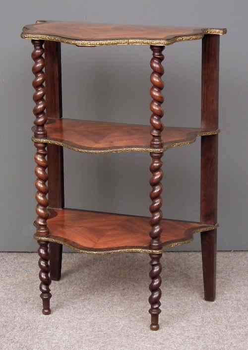 Appraisal: A th Century French tulipwood three tier etagere of shaped