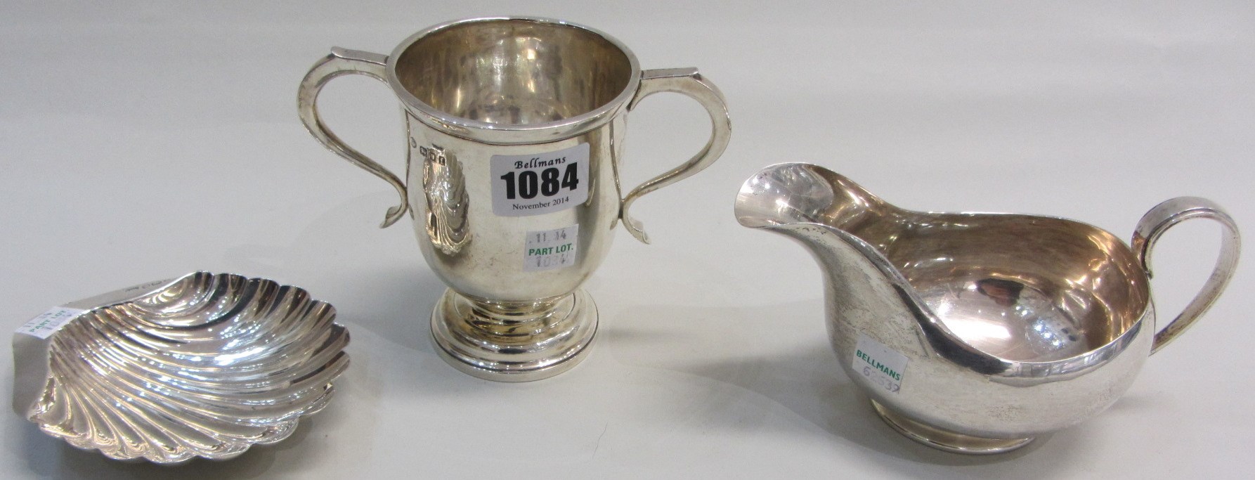 Appraisal: Silver comprising a twin handled trophy cup on a circular