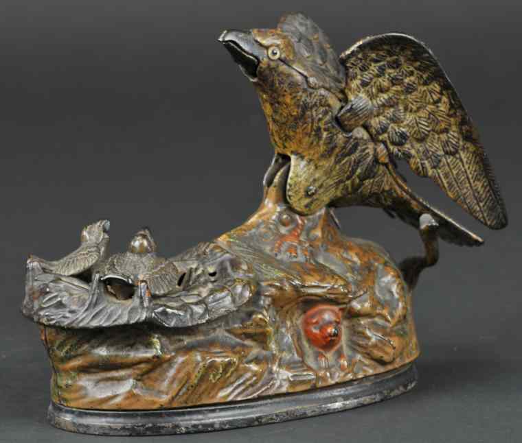 Appraisal: EAGLE EAGLETS MECHANICAL BANK Brown base J E Stevens Co