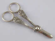 Appraisal: A pair of late Victorian sterling silver grape scissors by