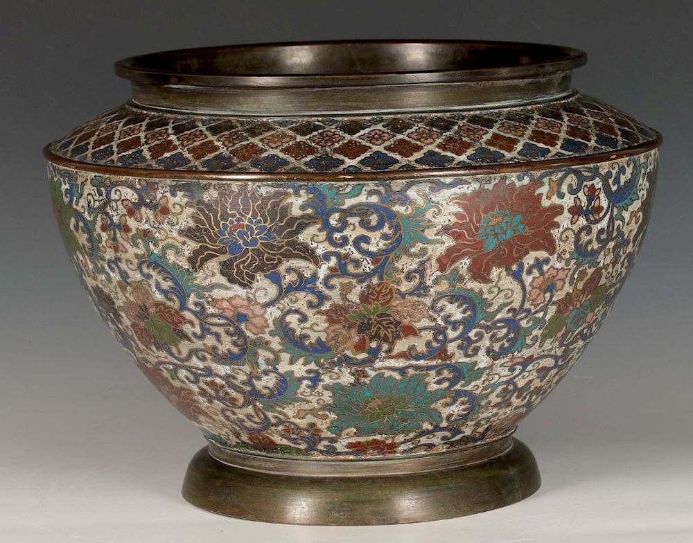 Appraisal: A CHINESE BRONZE JARDINIERE WITH CHAMPLEVE' ENAMEL Florals and vinery