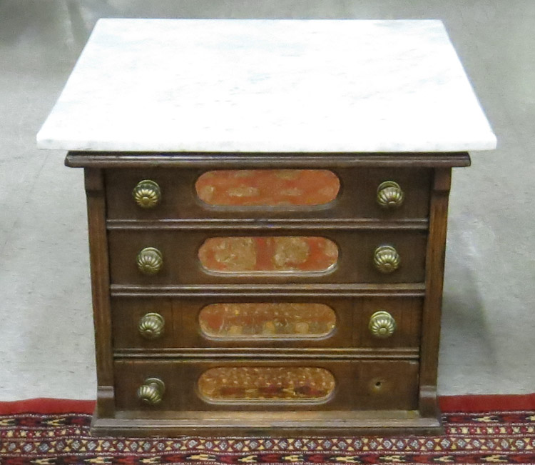 Appraisal: VICTORIAN MARBLE-TOP OAK SPOOL CHEST American late th century having